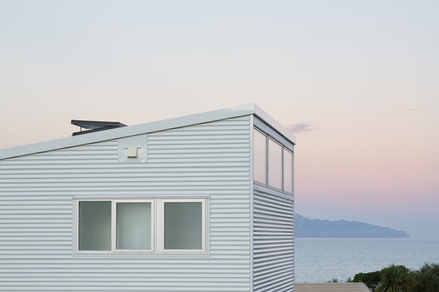 Langs Beach House, 2015. High windows reflect the colours of the evening sky.