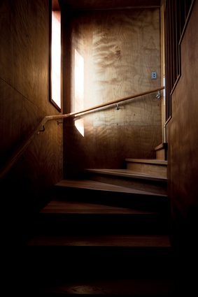 A slot of light in the stairwell in the Tawini House.