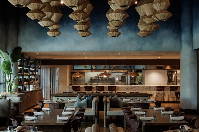 Custom hand-made sculptures crafted from banana leaves and suspended from the 7-metre-high ceiling are a focal point in the centre of the restaurant.