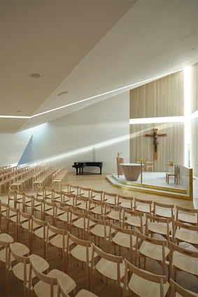 Noble simplicity: sundial-like shafts of light illuminate the white geometry of the chapel and its restrained palette of marble, brass and oak for the altar space and furniture. 