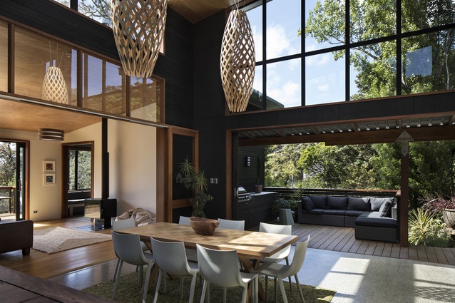 Whare Koa House, Mahurangi West, New Zealand, by SGA Architects. 2017. The open atrium is a multi-functional space that breaks up the scale and bulk of the home.