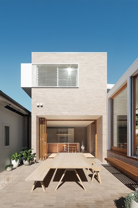 The courtyard separates the old and new sections of the house, with living spaces positioned around it.