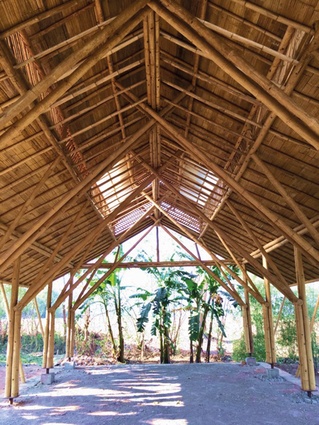 An interior view of the Amway Hlu bamboo structure and woven bamboo ceiling lining.