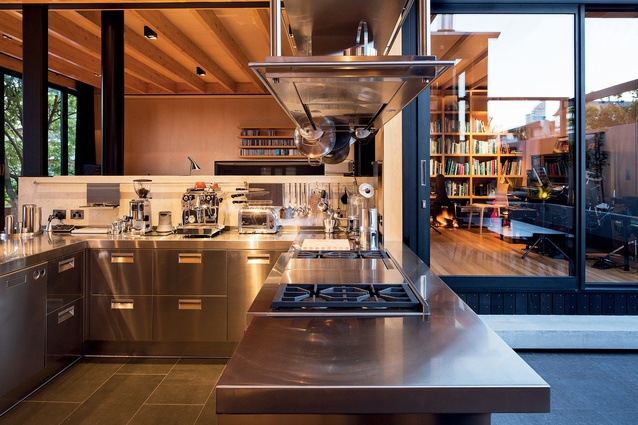 The galley-style kitchen, with its stainless steel finish, is another nod to the design’s nautical inspiration. 
