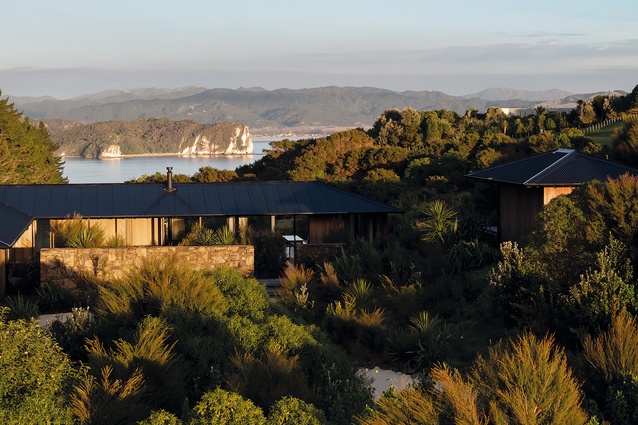 The Popadich House viewed from the east, with the walled garden in the foreground and studio/ guest house at right. Cooks Bay is to the west, with Whitianga in the far distance.