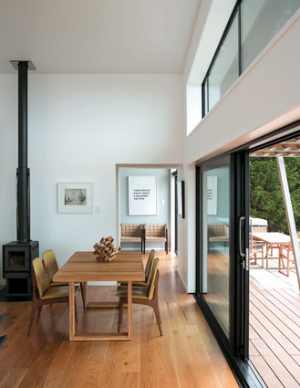The open-plan living area opens up to decking along the north side of the house.