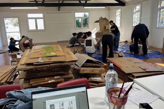 The group making the exhibition signage which will become part of the show after this week.
