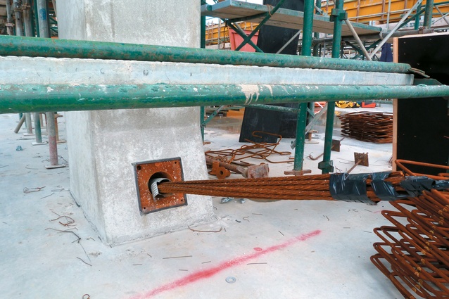 Post tensioned beams are poured in situ and then tensioned later. Here you can see the rods protruding through a beam, ready to be tensioned.