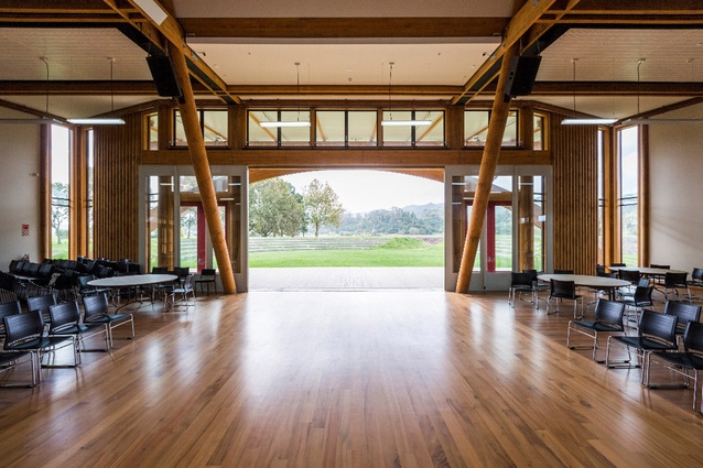 Landscaped terraced seating can be seen from inside the arched entrance. This marae ātea is where visitors are formally welcomed and issues are debated.