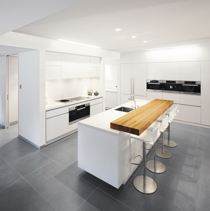 The crisp, white kitchen was designed by Ingrid Geldof Design.