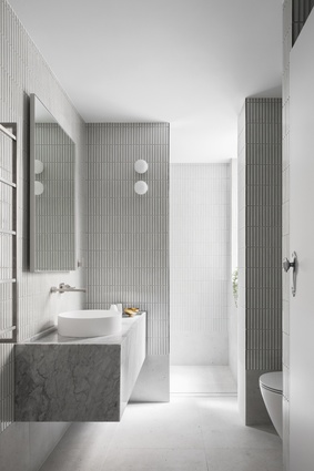 Challis Avenue Apartment’s bathroom by Retallack Thompson is a minimalist study in clean lines and pared-back materiality.