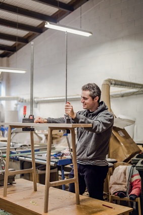 Ben Glass working in his workshop, adjacent to his Newton showroom.