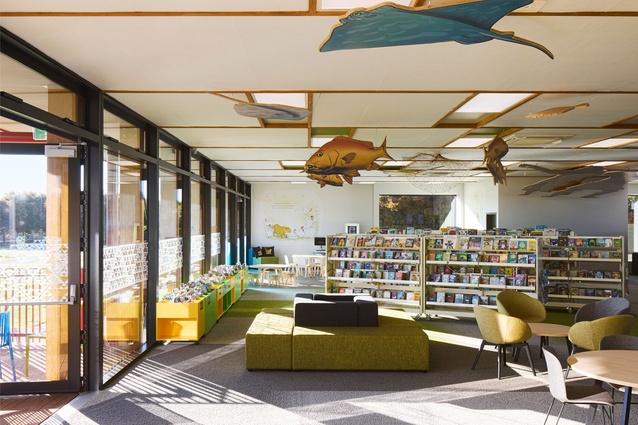 The children's space incorporates modular furniture for collaboration and group learning.