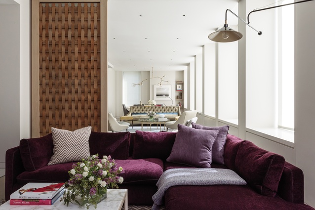 The family room features a purple Montauk sofa, chosen for its comfort and size. 