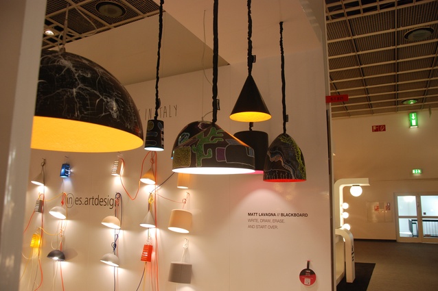 These Matt lamps by ines.artdesign have a blackboard outer. The company brought in artists to sketch on the lamps at certain times during the fair.