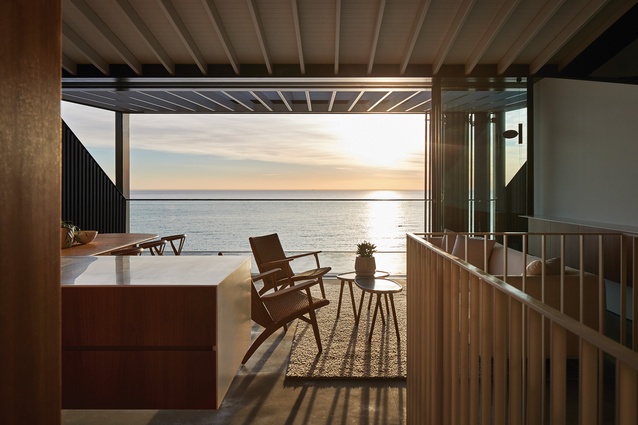 The ocean is strategically framed to eliminate all neighbouring properties from view, enabling a more intimate connection with the water despite the home’s suburban context.
