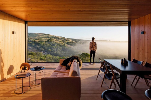 Retreat in Finca Aguy is a compact house by MAPA in Uruguay that was prefabricated in a factory and then shipped 200 kilometres to its destination in an olive grove.