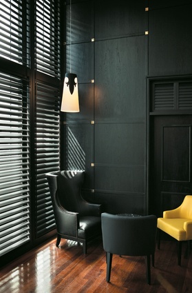 Wingbacked chairs from a New Zealand supplier were given a more contemporary form. Dark timber louvres have a more colonial reference.