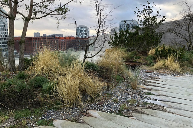 The top floor opens to a landscaped terrace area.