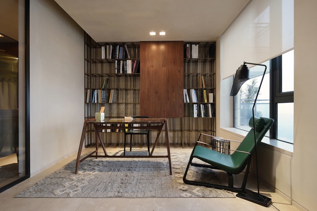 An office area includes a desk by Porada and an armchair by Jean Prouvé. 