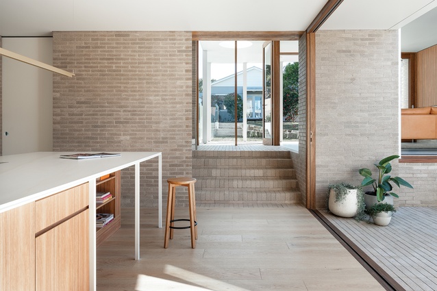 The expressed brick steps accentuate the idea of the house as a series of gently ascending platforms.