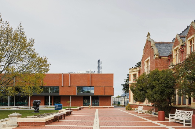 The western approach follows along the front of the red-brick-clad Ivey Hall.