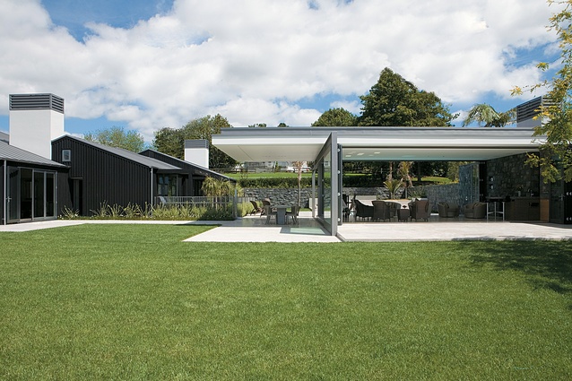 The pool house in relation to the more traditional but substantially reworked existing house.