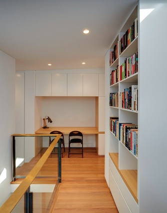 A nook between the upstairs bedrooms, complete with lovingly crafted joinery, offers a quiet spot for study.