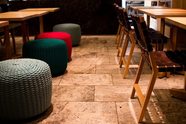Bold rope ottoman stools offer bright bursts of colour and dew-like luminaires punctuate the space. 