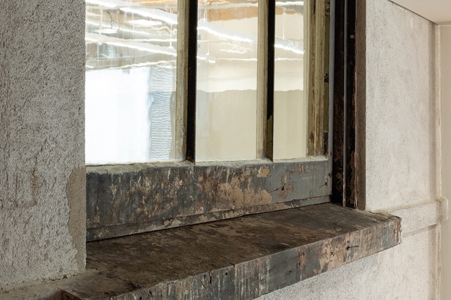 One of the original clerestory windows is presented raw, as found, with no attempt to smarten it up and return it to a former, pristine state.