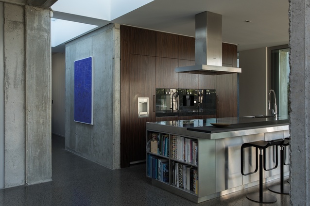 Poured House: The kitchen is flooded with natural light from above. 

