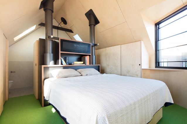 Every available space is used wisely, including a bedroom tucked under the peaked roof.