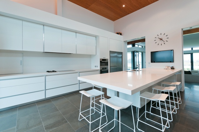 The large kitchen has a crisp, clean, white colour palette.
