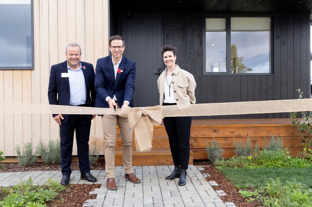 Steve Evans and Nicola Tagiston with the Honourable Chris Penk, Minister of Building and Construction cutting the ribbon.