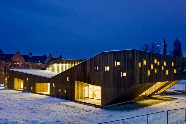 Fagerborg Kindergarten, Norway by Reiulf Ramstad Architects. One end of the organic-looking building cantilevers to create a sheltered entrance space.