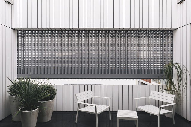 The perforated screens on the deck are a point of interest, while also acting as a wind filter.