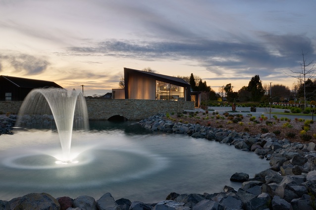 The Café looks out over picturesque grounds including a schist stone bridge and pool, also by Turner Road Architecture.