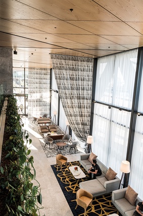 The double-height space within the lobby area creates an impressive arrival experience. 