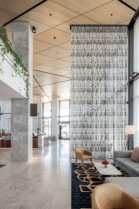 Woollen, hand-tufted, custom-designed rugs line the lobby floor and were designed to represent the changing topography of the local landscape.