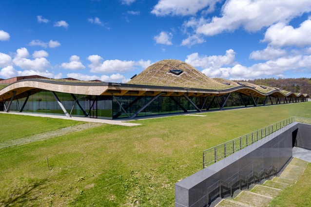 The Macallan distillery and visitors experience in north Scotland by Rogers Stirk Harbour + Partners. The rippling roof is set into the sloping landscape and is covered in native fauna.