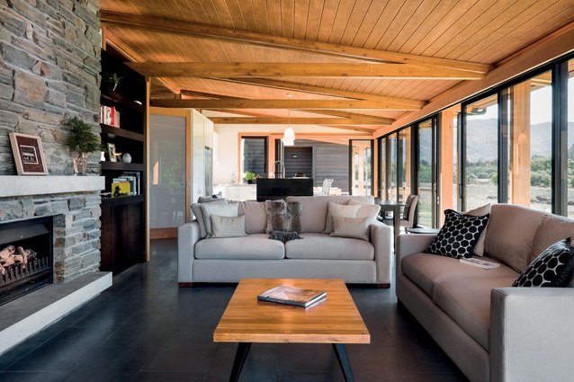 Glulam trusses in the open-plan living area match the columns on the verandah.