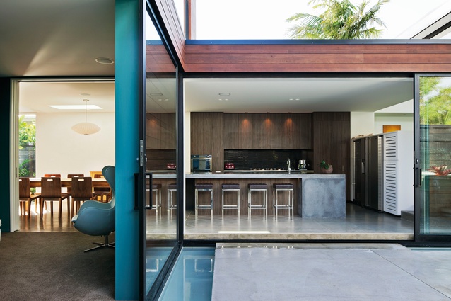 Misaligned House: A garden courtyard is the focal point to the internal living areas, which are designed as visually connected social spaces.