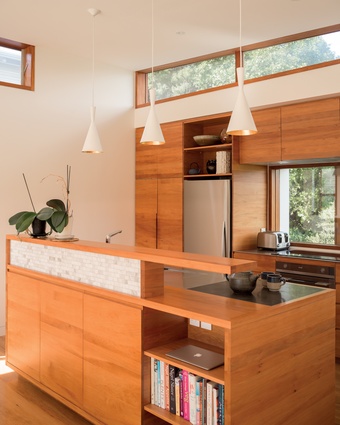 Native totara is used throughout the interior, including in this kitchen joinery. Totara creates a rich and warm environment in which to live.