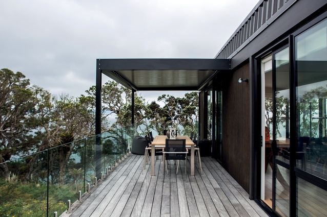 On the western side, the balcony looks out towards the water and further up to the Whangarei Heads.
