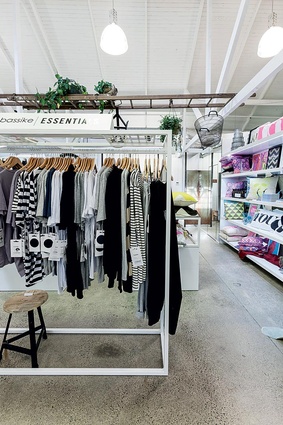 Racks of clothing alongside homewares and accessories.