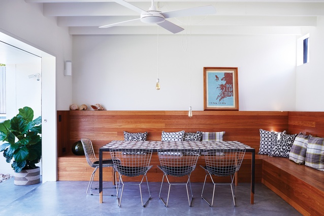 Sustainably sourced Tasmanian blackwood wraps around the dining area to create an inviting built-in bench seat.

