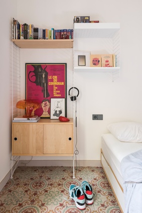 Graphic designs by Sigrid Calon, Hey Studio and Ares Design bring a sense of whimsy into the apartment’s bedrooms.