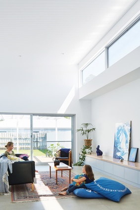 The new home provides generous light-filled volumes. Artwork: Annabelle Aronica, Sean Bailey.