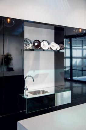 High-gloss, wall-hung cabinets with mirror vanity.