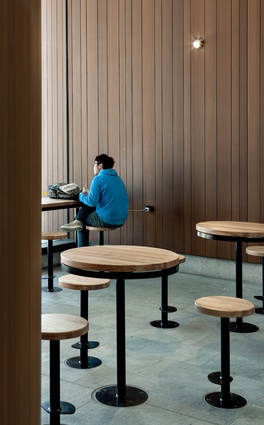 Timber seating is distributed throughout 
the interior waiting areas.